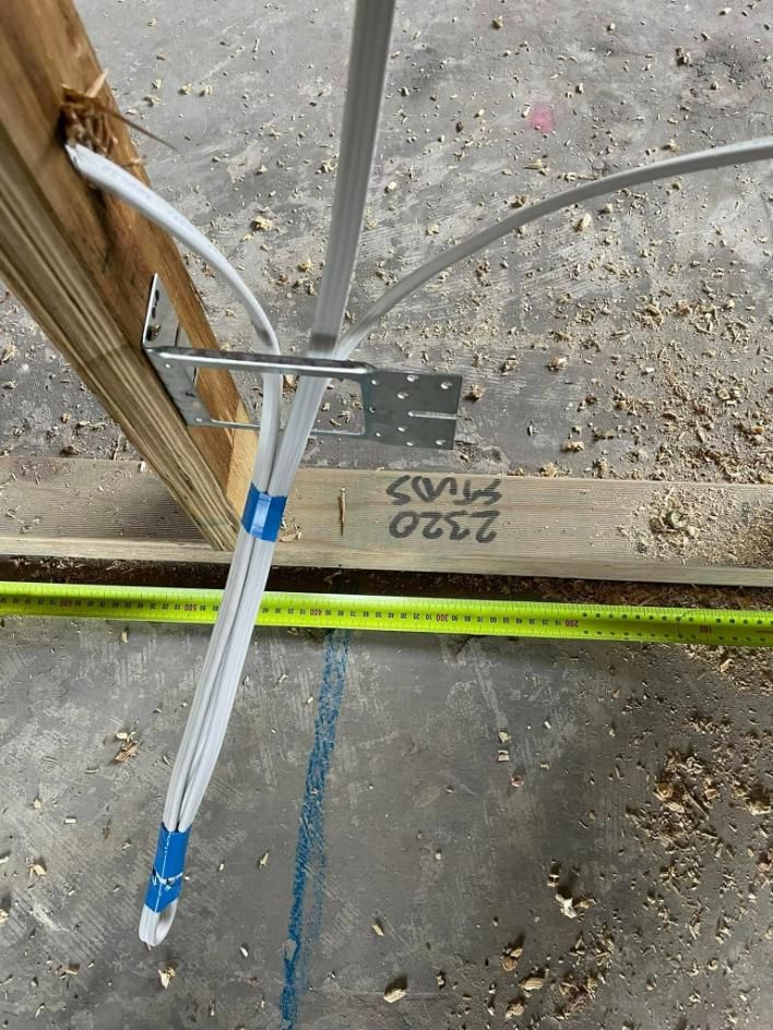 A Bunch Of Wires Are Hanging From A Wooden Beam — Connect Mid Coast Electrical Services In Forster, NSW