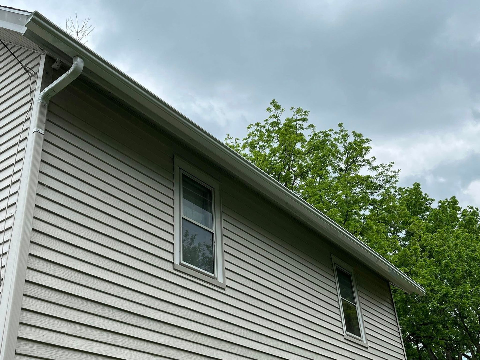New gutters installed on second story of Rochester area home