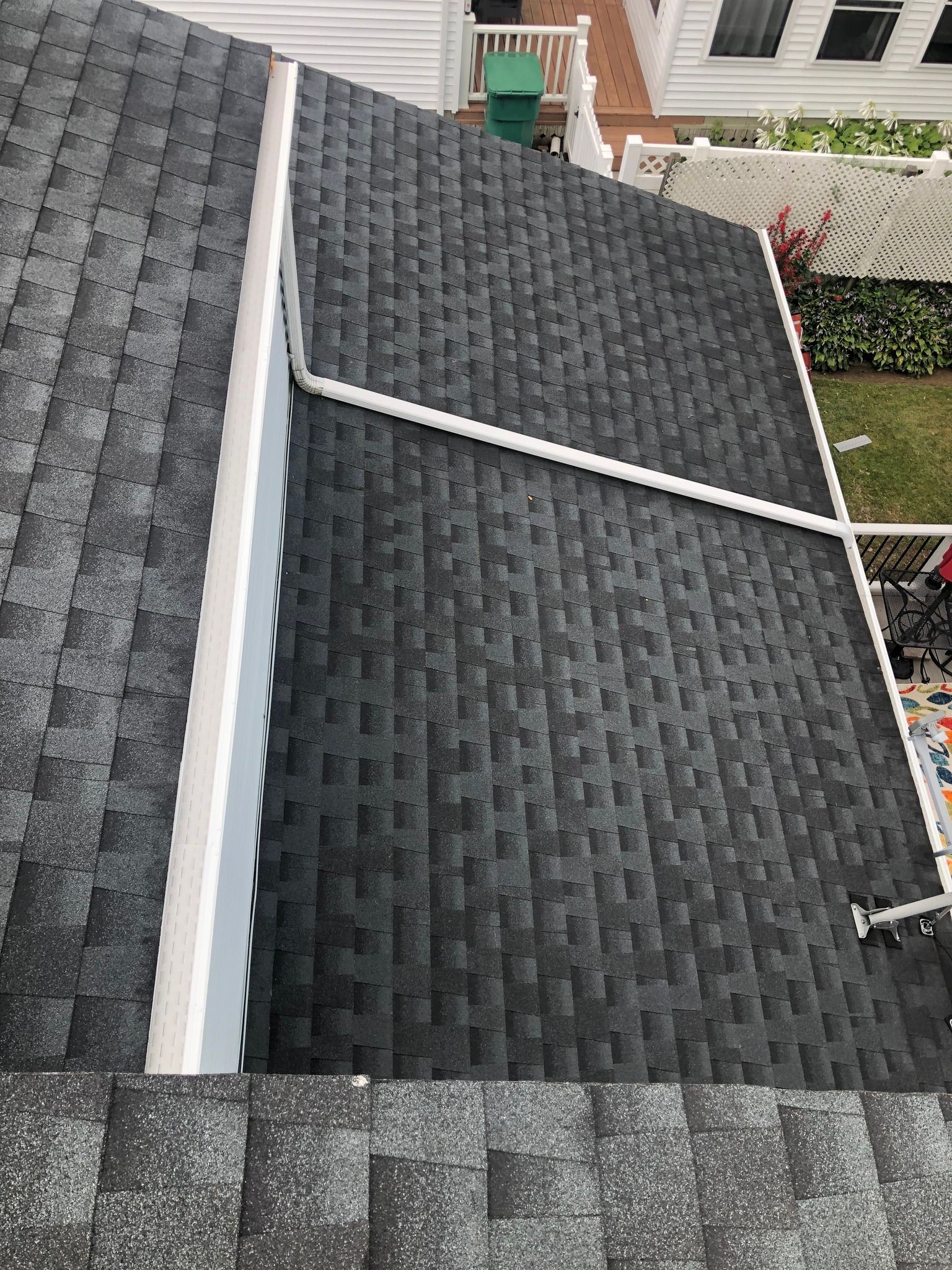 New gutter system installed on a roof, seen from above