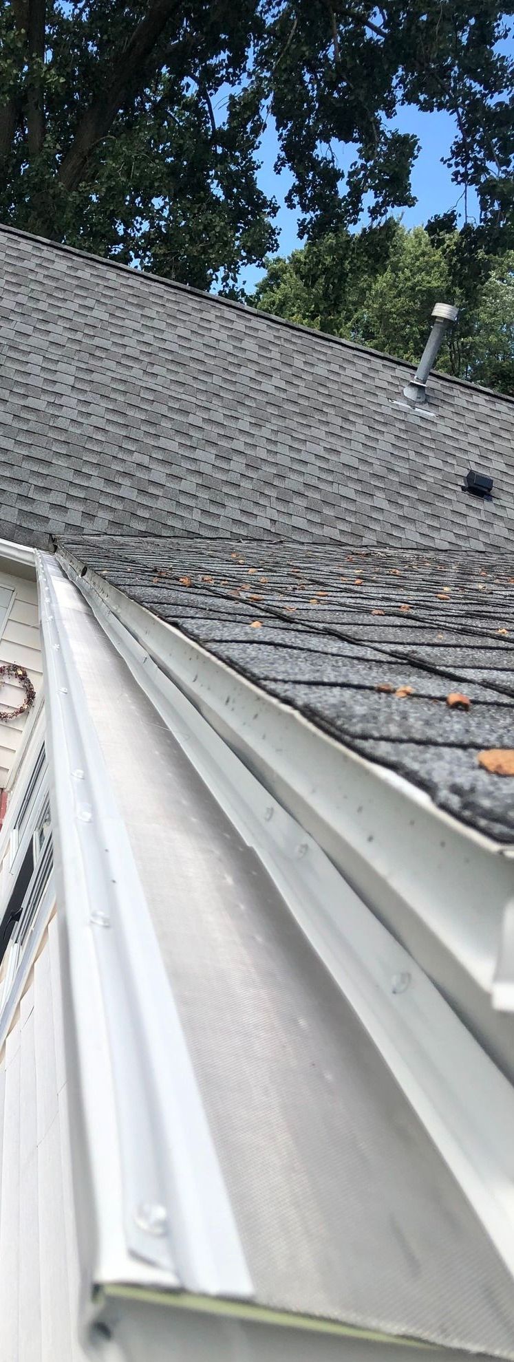 New gutter guards completely installed on a gutter system