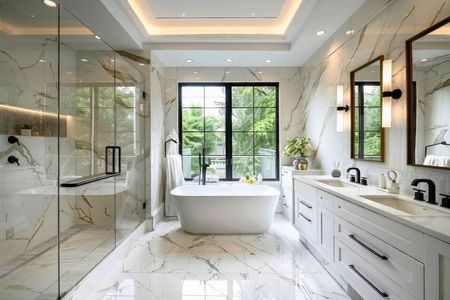 Bright modern bathroom with freestanding tub, glass shower, and double vanity overlooking greenery