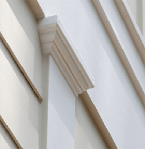 Close-up of white decorative trim molding on a building facade