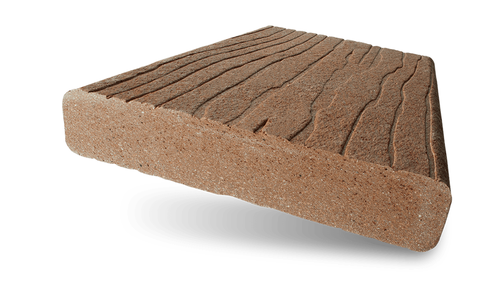 Brown textured wedge-shaped block with grooved top on a white background