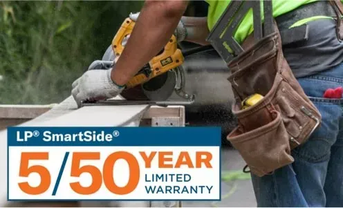 Worker using a yellow power tool beside an LP SmartSide 5/50 year limited warranty sign