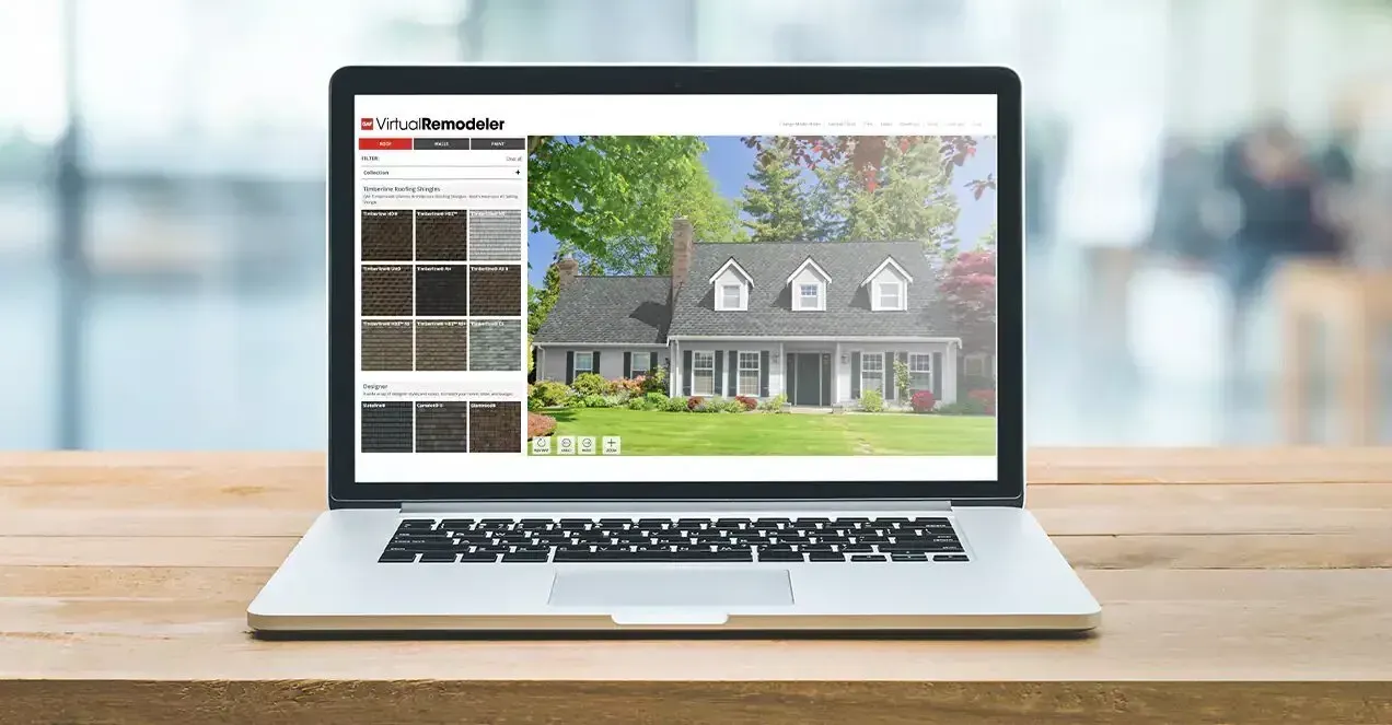 Laptop on a wooden table displaying a house listing website with a home photo and property tiles