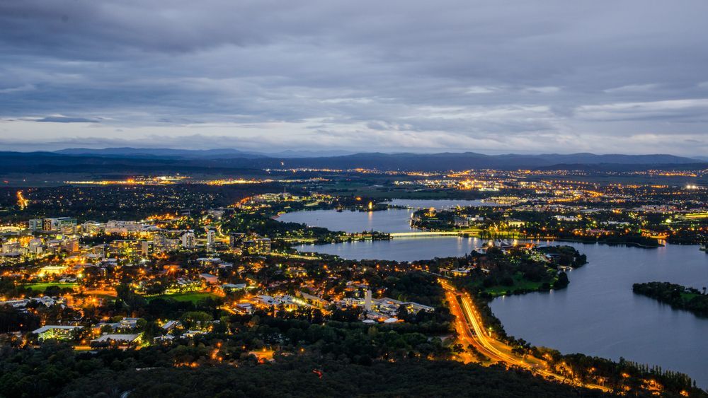 Nighttime Aerial Shot Of Brisbane Showcasing City Lights And Urban Landscape — Sydney Underfloor Heating in Woonona, NSW