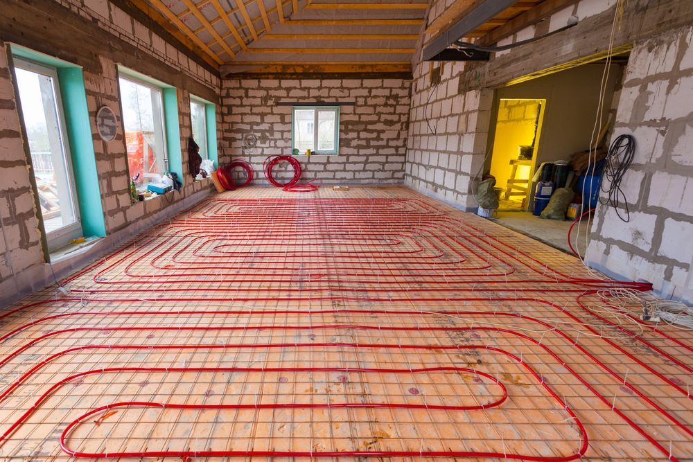 Pipefitter Installing System Of Heating Or Underfloor Heating Installation — Sydney Underfloor Heating in Woonona, NSW