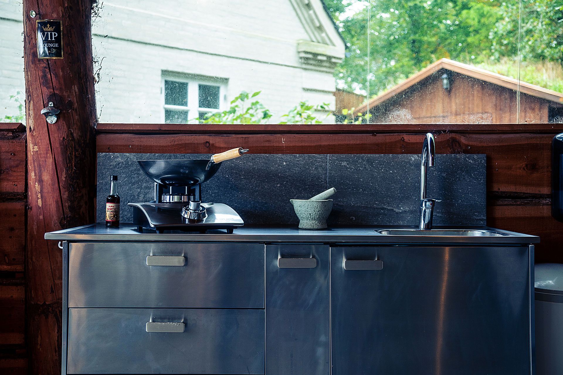 Outdoor kitchen with built-in grill and storage