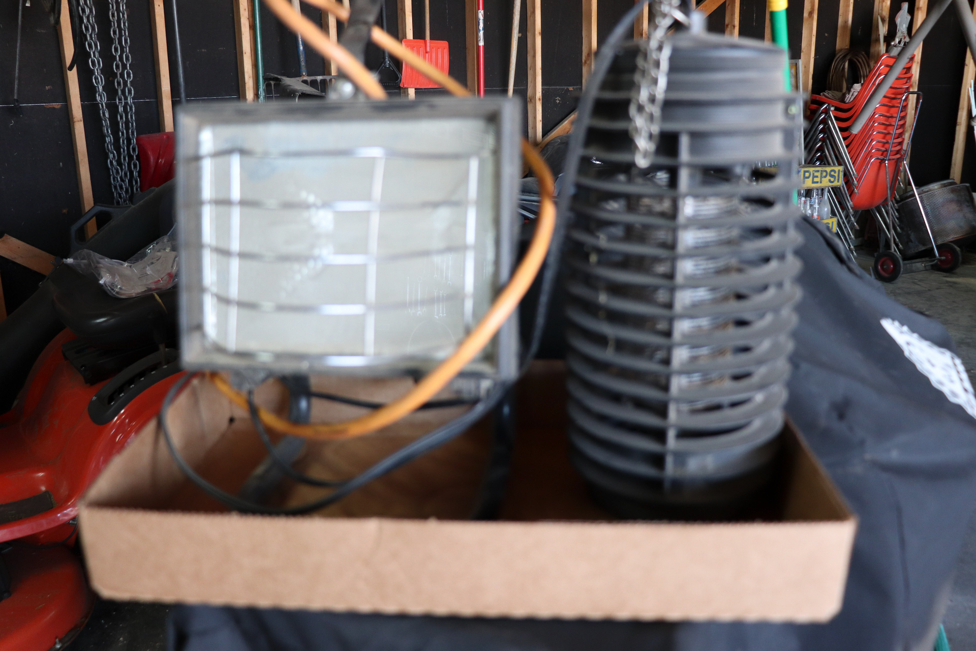A box with a light and a bug killer on it