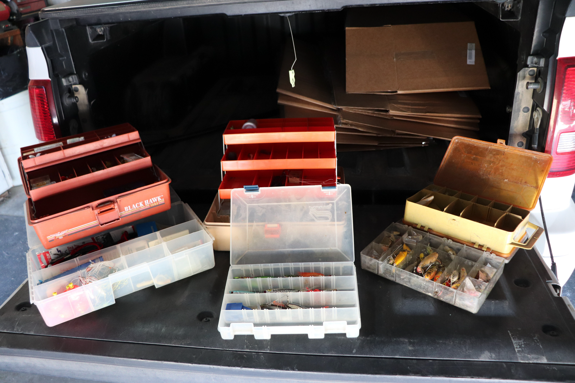 A bunch of boxes in the back of a truck