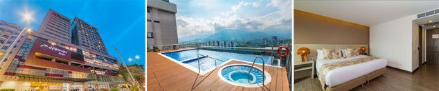 Una imagen borrosa del horizonte de una ciudad, una piscina y un dormitorio.