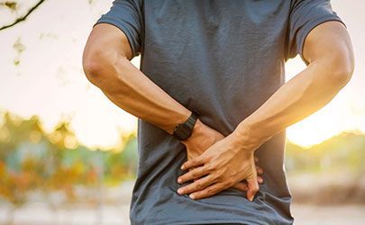 man with sciatica pain in his lower back