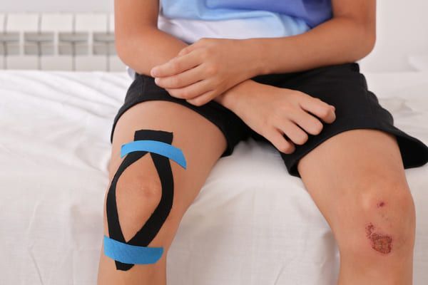 taping treatment as part of children sports injury treatment