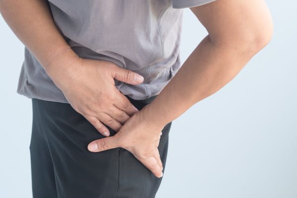 man experiencing hip pain caused by bursitis 