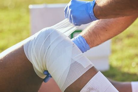 woman getting sports injury treatment