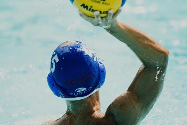 man with a shoulder impingement caused by water polo