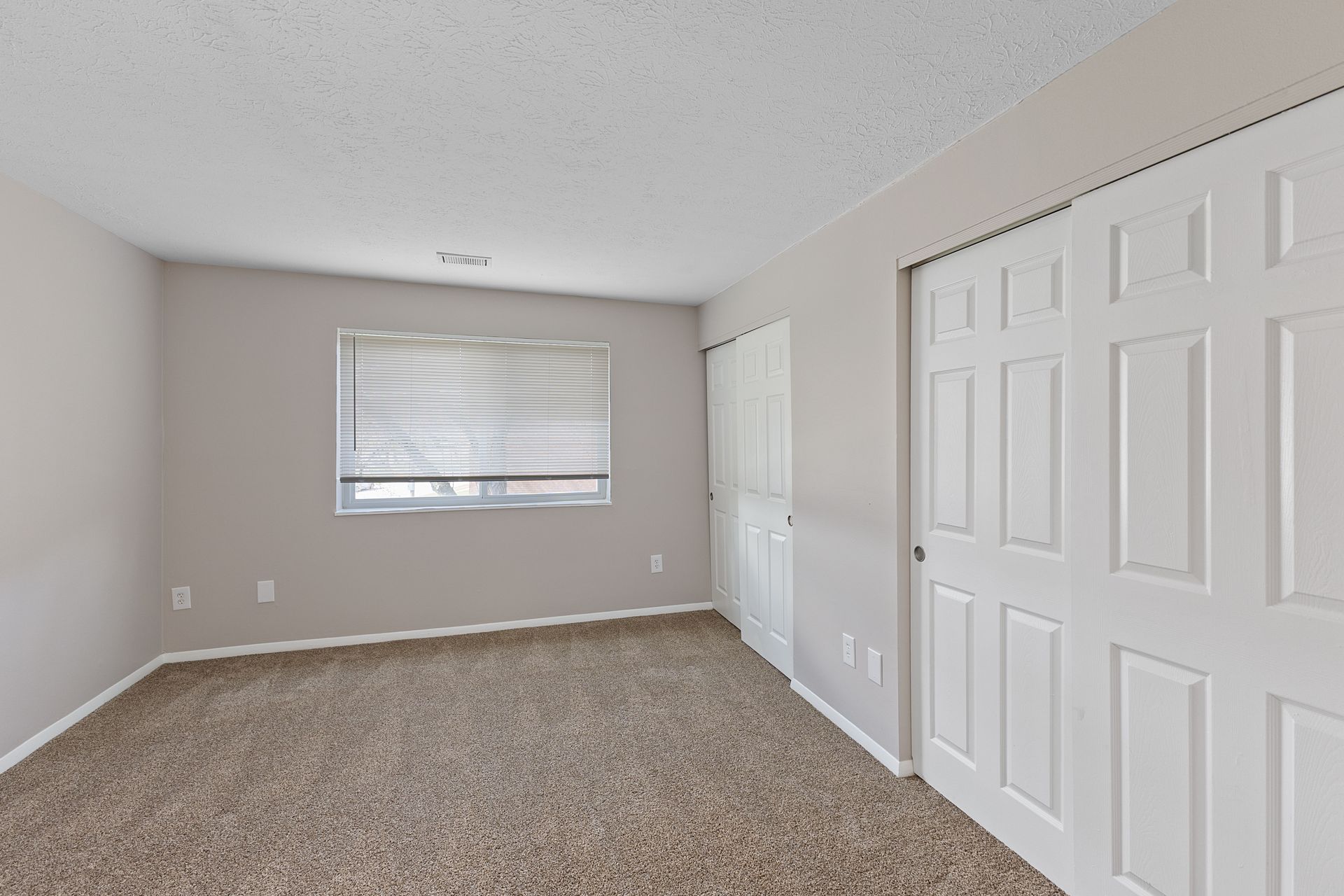a photo of the bedroom with two spacious closets at The Wimbledons 