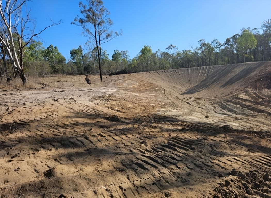 A Dirt Field With Trees — Greenslade's Dozer & Excavator Hire Pty Ltd In Nanango, QLD