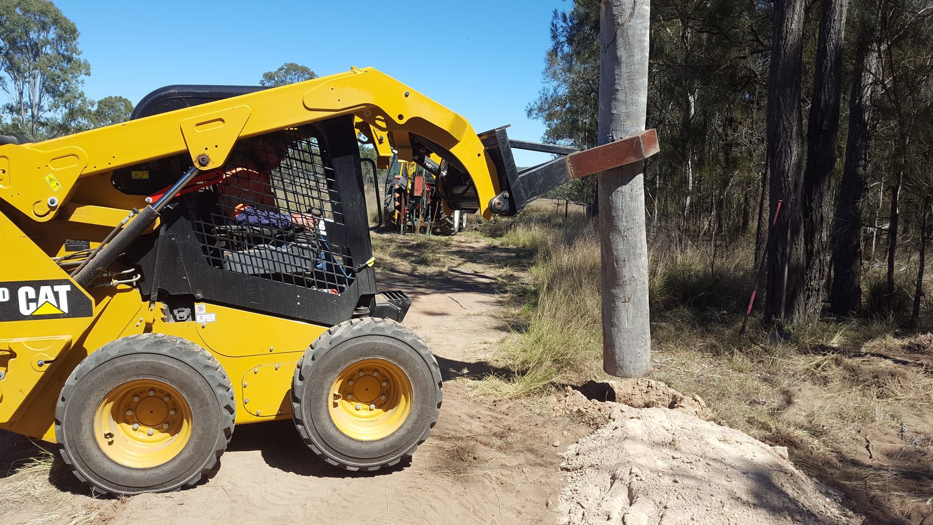 A Bulldozer Is Parked In A Dirt Field — Greenslade's Dozer & Excavator Hire Pty Ltd In Taabinga, QLD