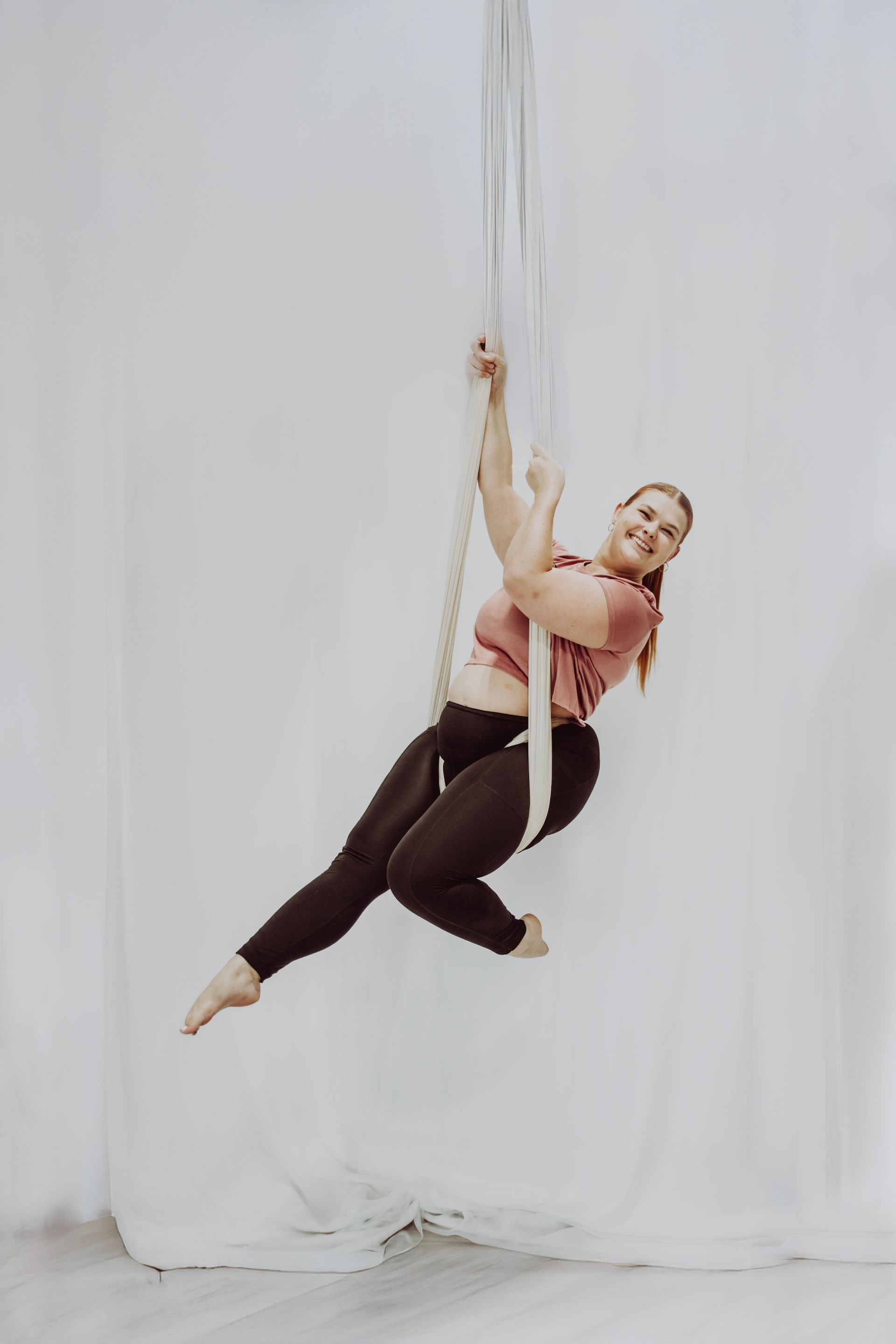 aerial aerobics, aerial fitness studio lubbock, pole fitness studio near me, aerial fitness classes, circus classes, fun group fitness, adult dance classes, aerial silks lubbock, aerial sling, aerial hammock