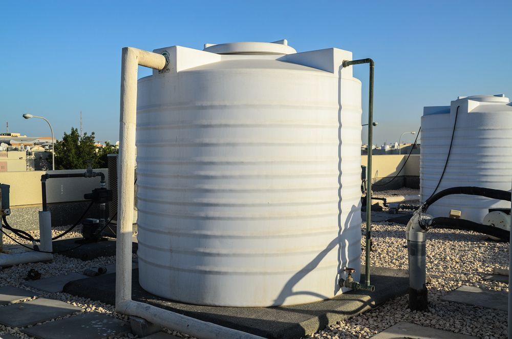 White Water Tank on a Rooftop — Raptor Waste Management in Coolangatta, QLD