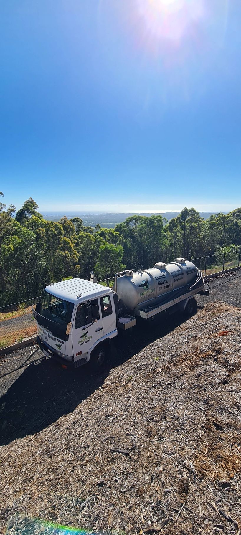 White Truck With a Silver Tank Trailer on a Gravel Road  — Raptor Waste Management in Coolangatta, QLD