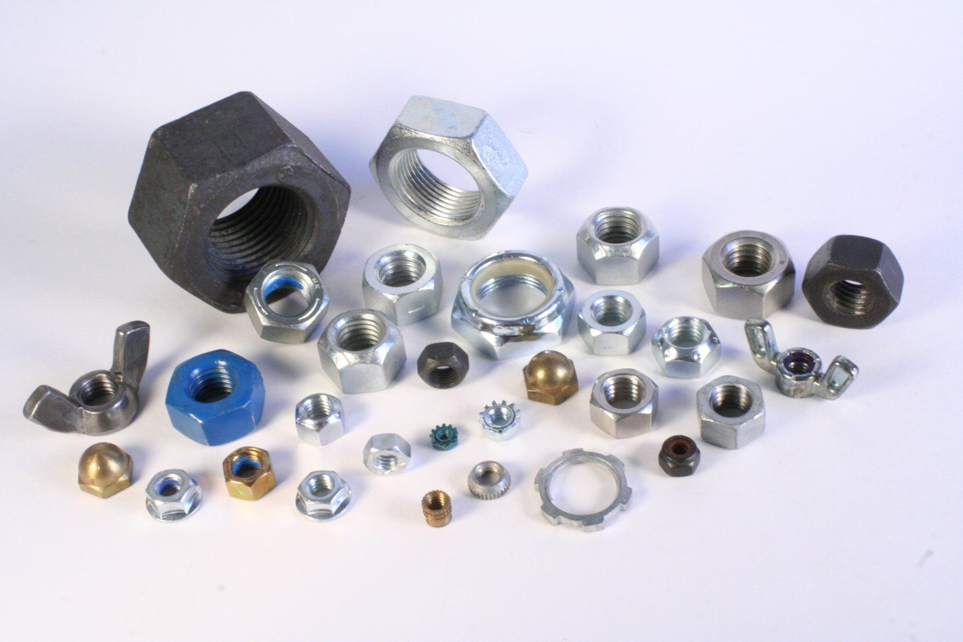 There are many different types of nuts on the table.