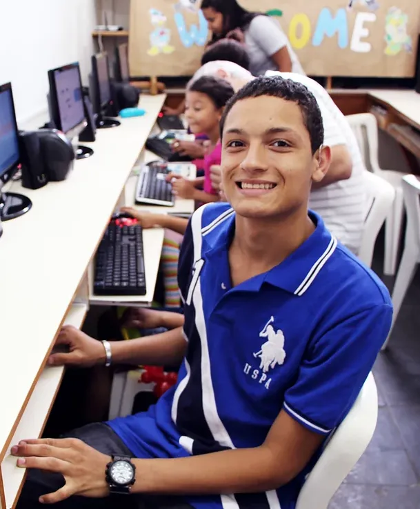A boy wearing a blue polo shirt with the word uspa on it