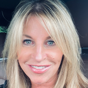 A woman with blonde hair and blue eyes is smiling for the camera.JILL FITZBURGH, BOARDMEMBER FOR OSF