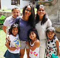 A group of young girls are posing for a picture together. KARLA OSORIO