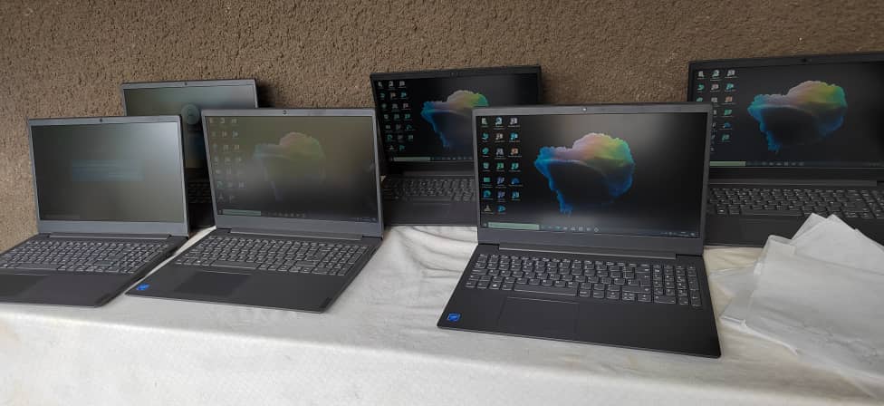 A group of laptops are sitting on top of a table.