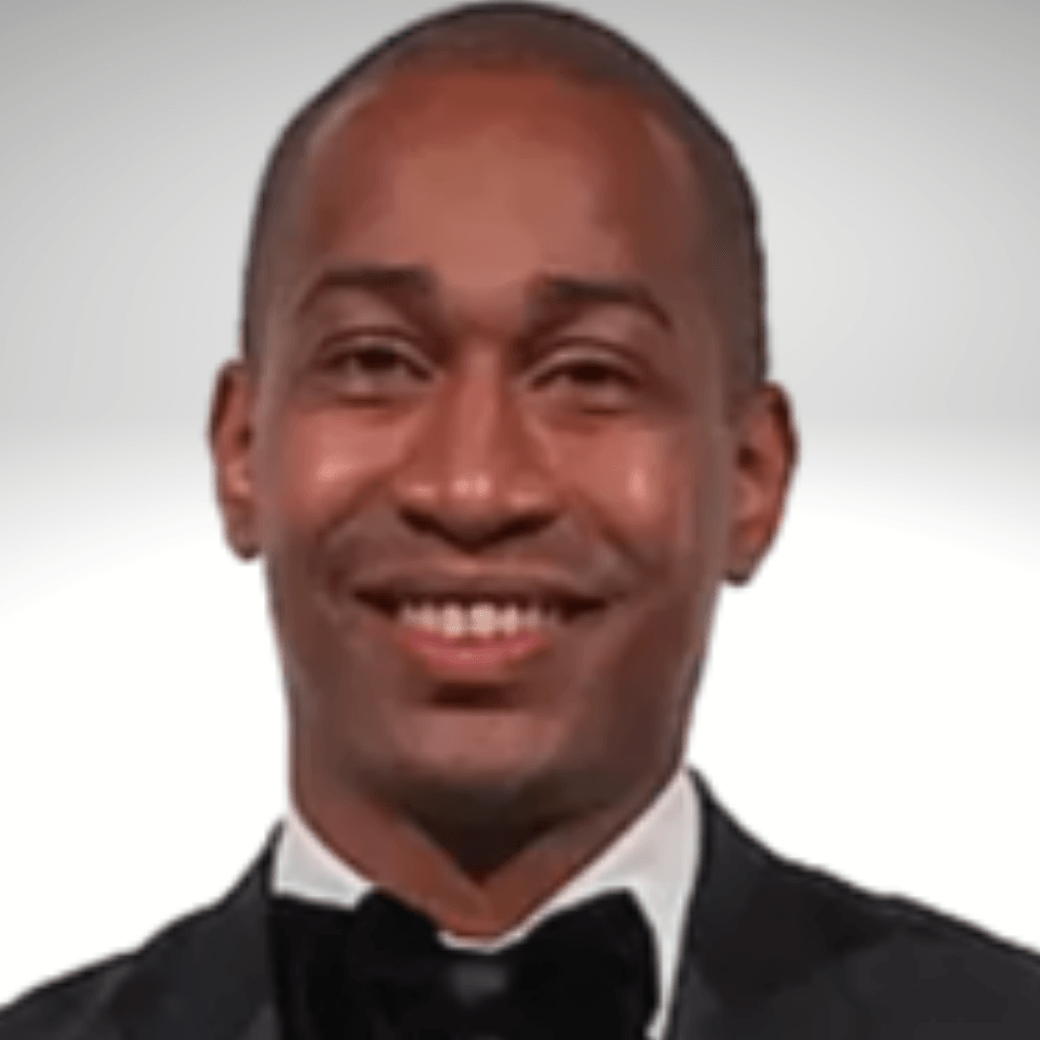 A man in a tuxedo and bow tie smiles for the camera ROBERTO FELIPE BOARDMEMBER FOR OSF
