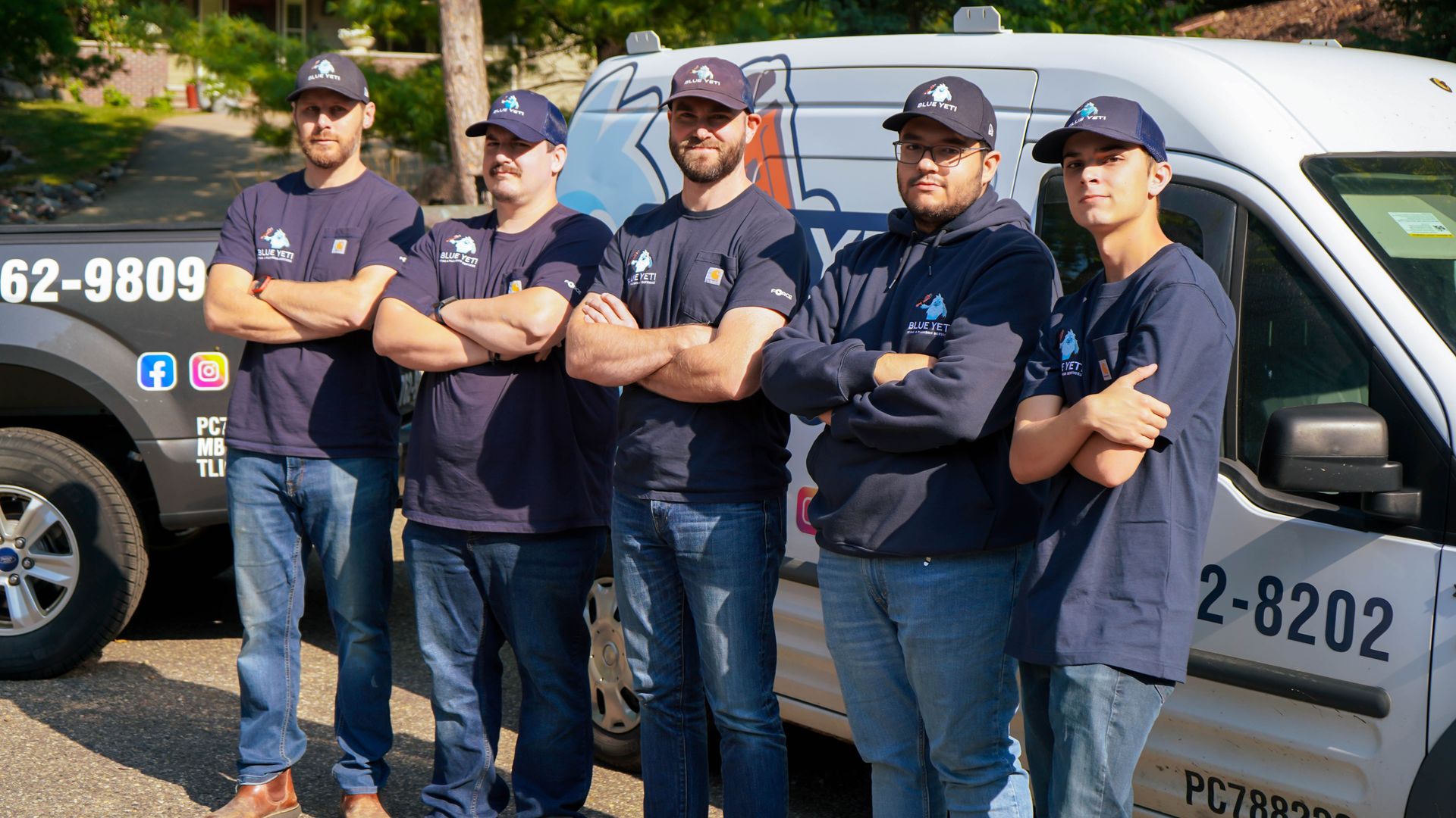 Blue Yeti team beside a branded service van