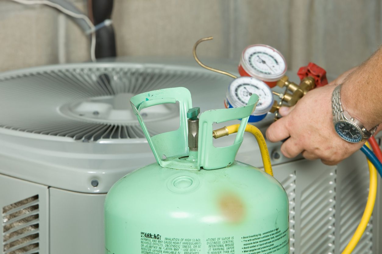 blue yeti technician installing AC refrigerant