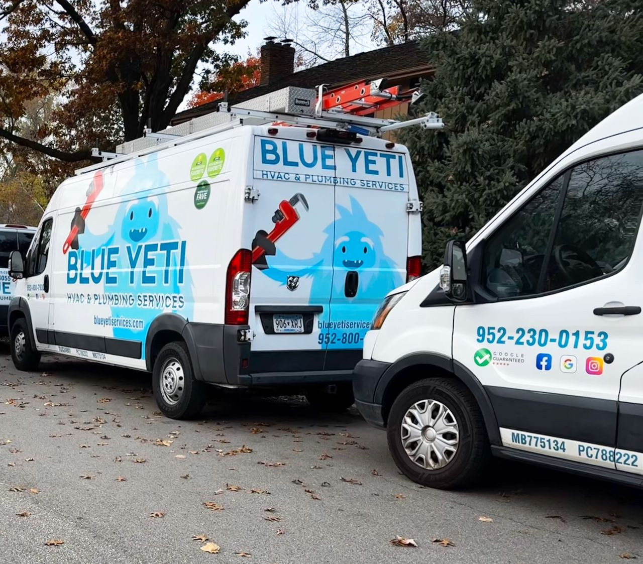 Blue Yeti Services technicians in front of their work trucks