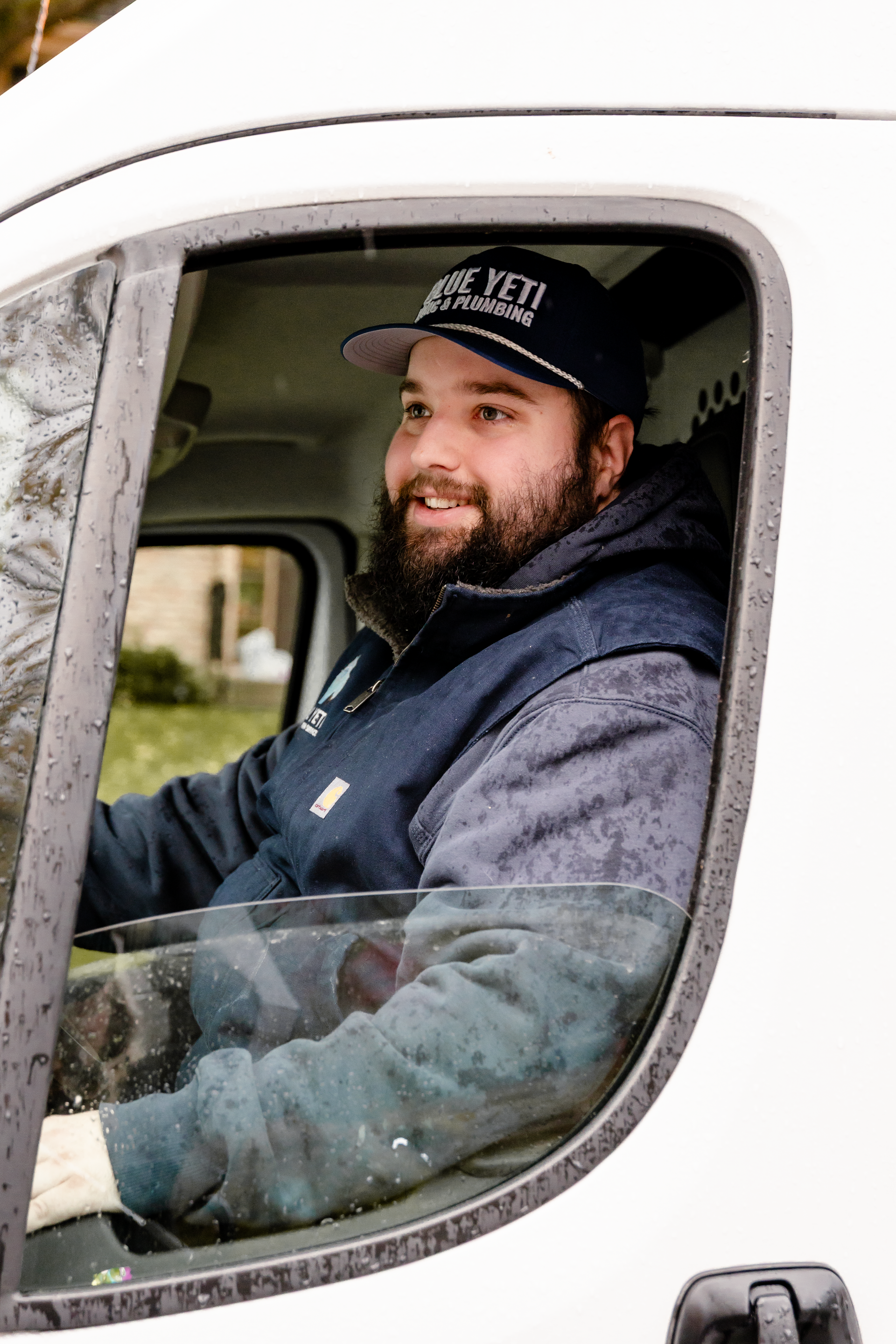 Blue Yeti HVAC Plumbing HVAC technician driving a white service van