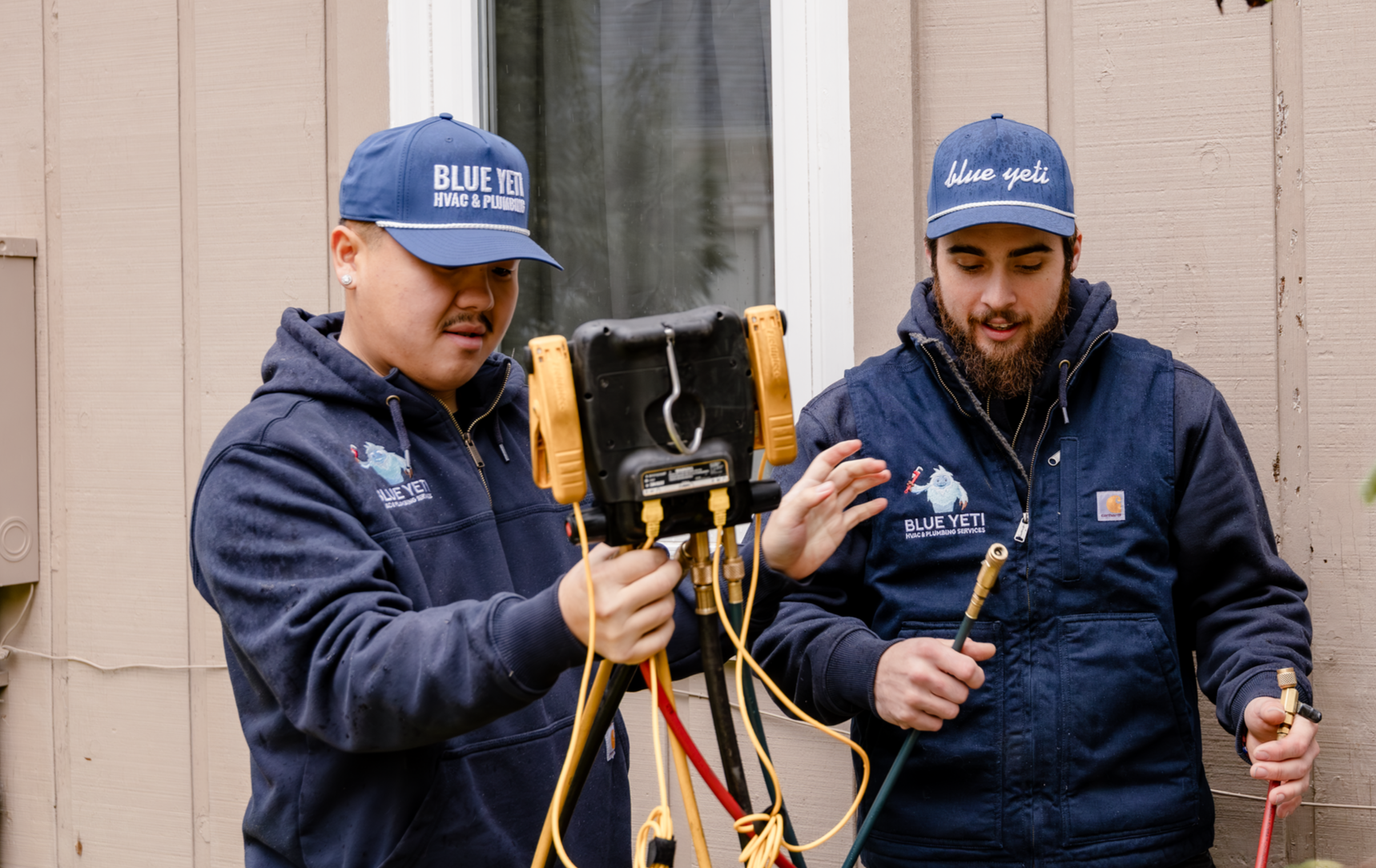 Two Blue Yeti technicians with service tools