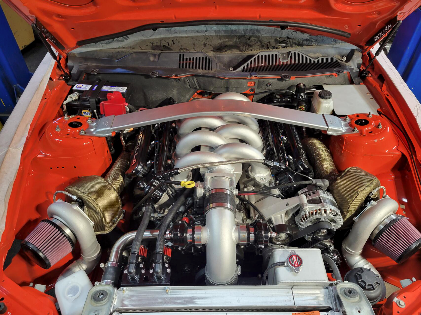 engine bay PS reservoir, coolant tank, catch cans, washer tank