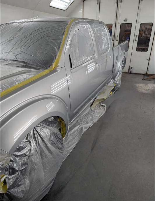 Painting car with spray gun