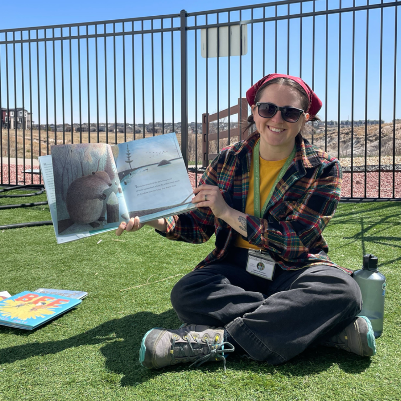 Spencer Kessinger reads a book outdoors.