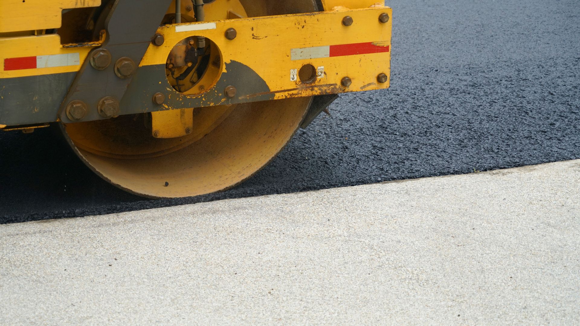 Truck Flattening the Asphalt — Prescott, AZ — Maurer Sealing & Striping