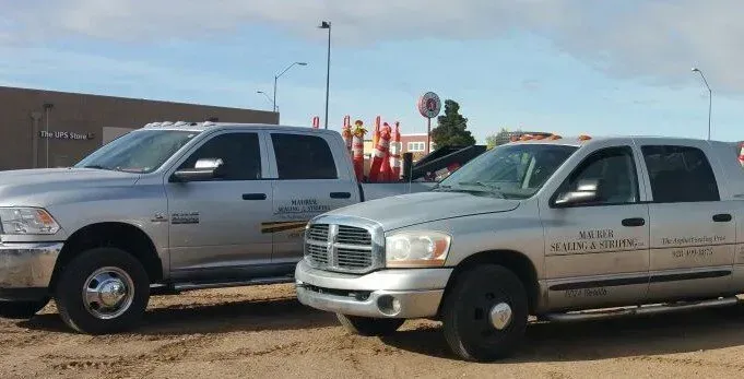 Two Silver Trucks are Parked Next to Each Other — Prescott, AZ — Maurer Sealing & Striping