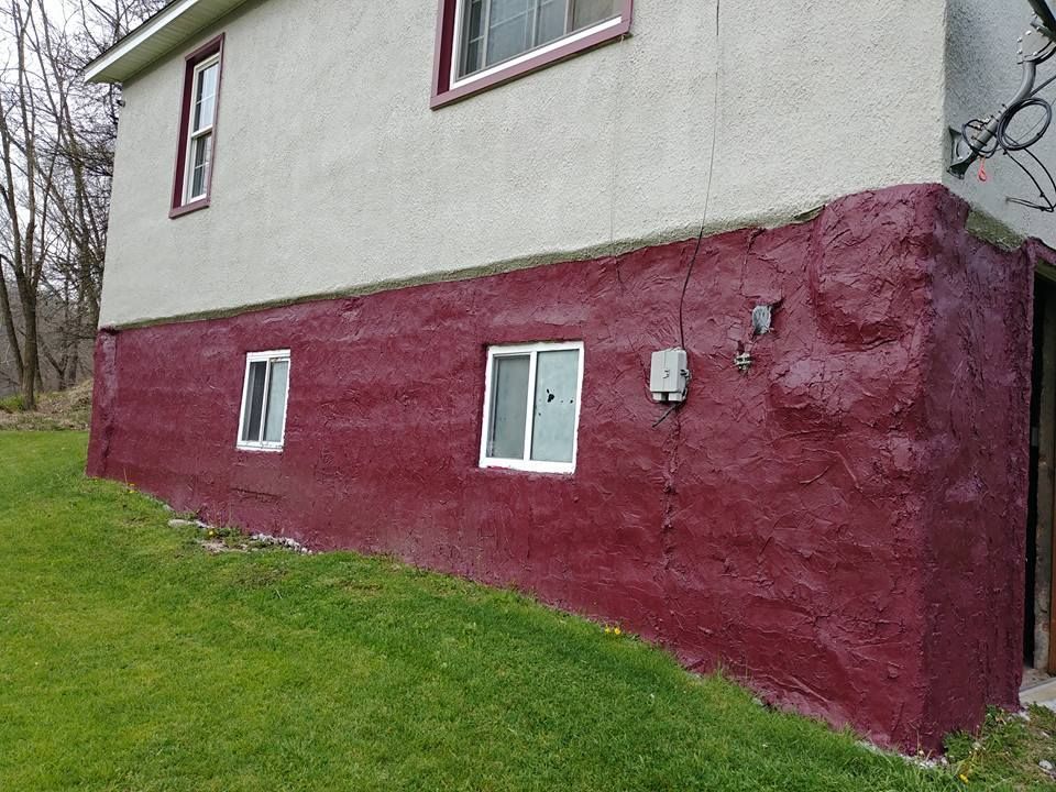 The side of a house is painted red and white.