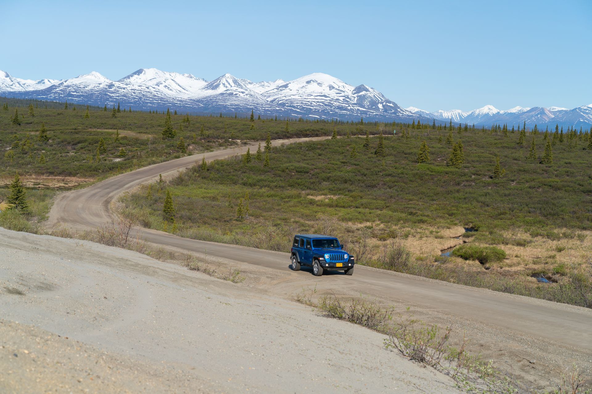 Blue car on a road