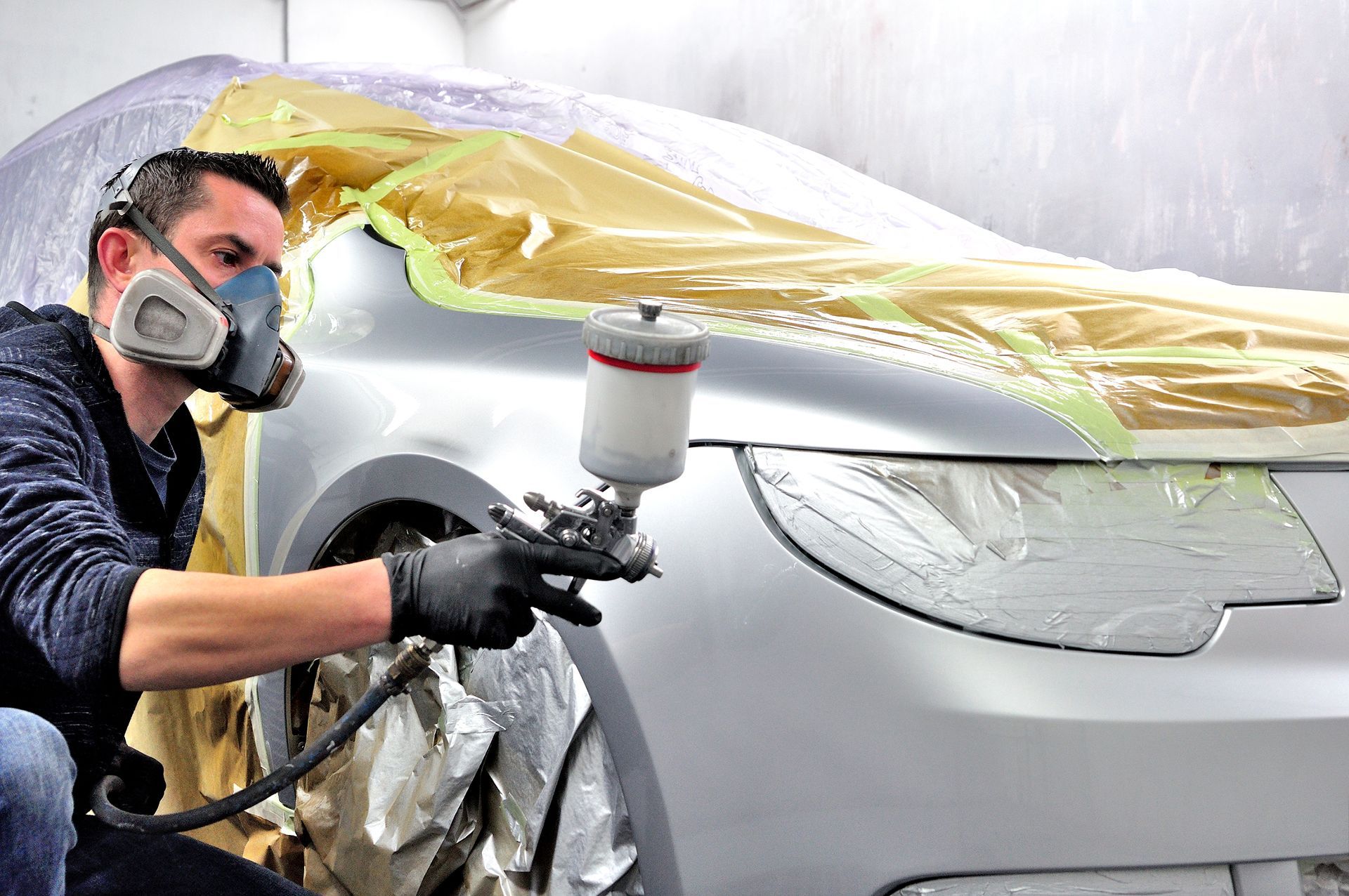 Man Painting Car With Gray — West Monroe, LA — Ken’s Body Shop
