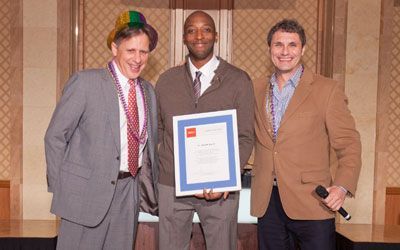 ACCJ Leader of the Year, Darrell Harris on stage receiving his award at the 2012 Champagne Ball.