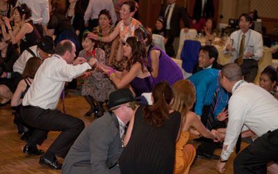A group of people are dancing on a dance floor.