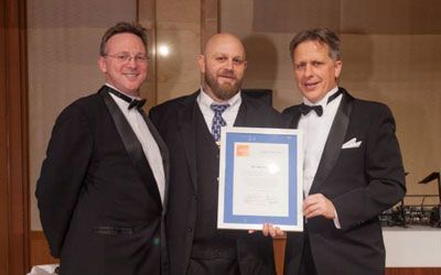 ACCJ Leader of the Year, Ray Proper on stage receiving his award at the 2014 Champagne Ball.