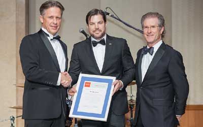 ACCJ Leader of the Year, Rob Jacobs on stage receiving his award at the 2015 Champagne Ball.