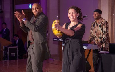 ACCJ Volunteer of the Year, Erik Olsen-Kikuchi on stage receiving his award at the 2016 Champagne Ball.